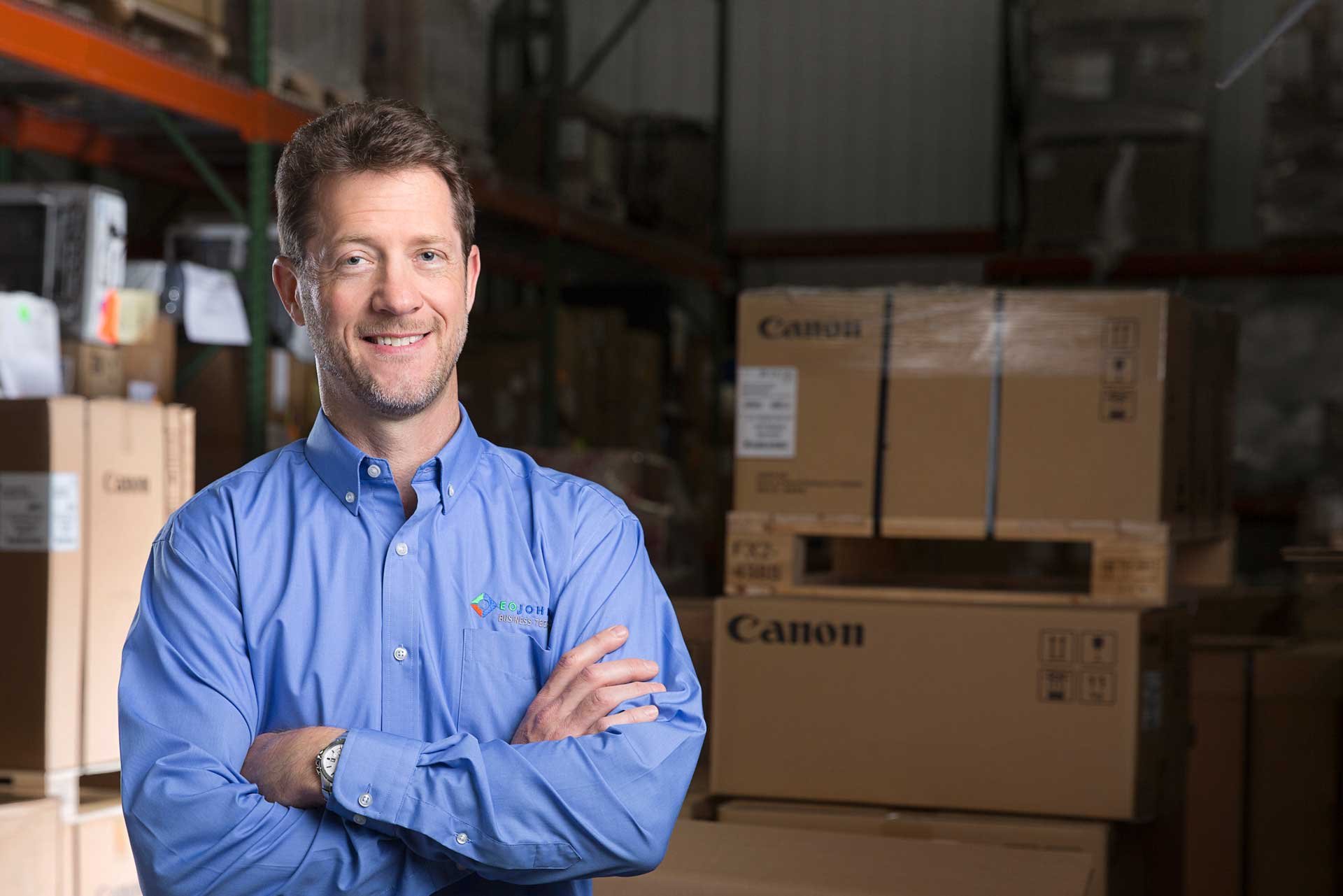 EO Johnson employee standing in warehouse