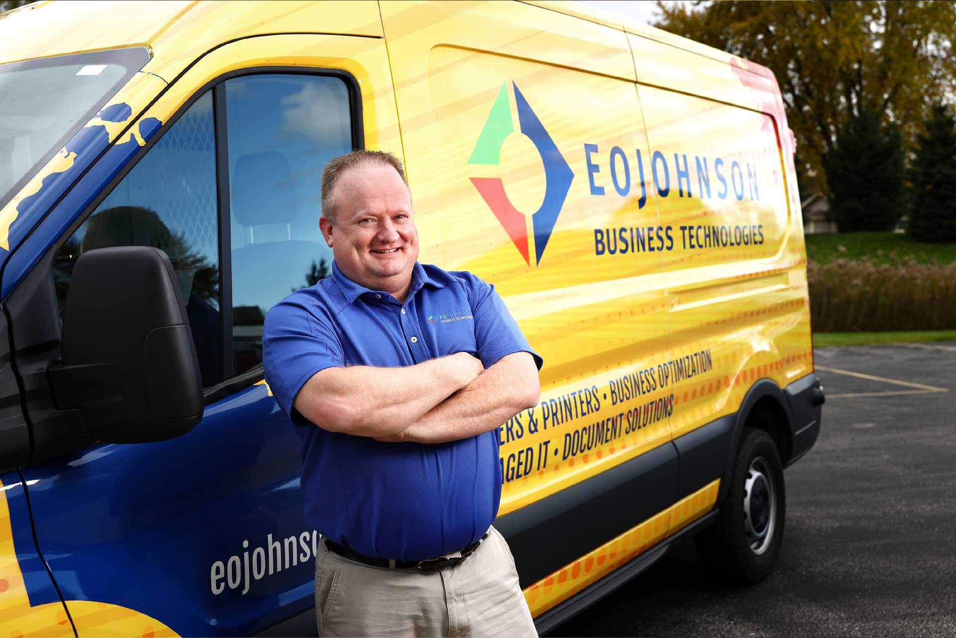 eo johnson employee smiling by print service van