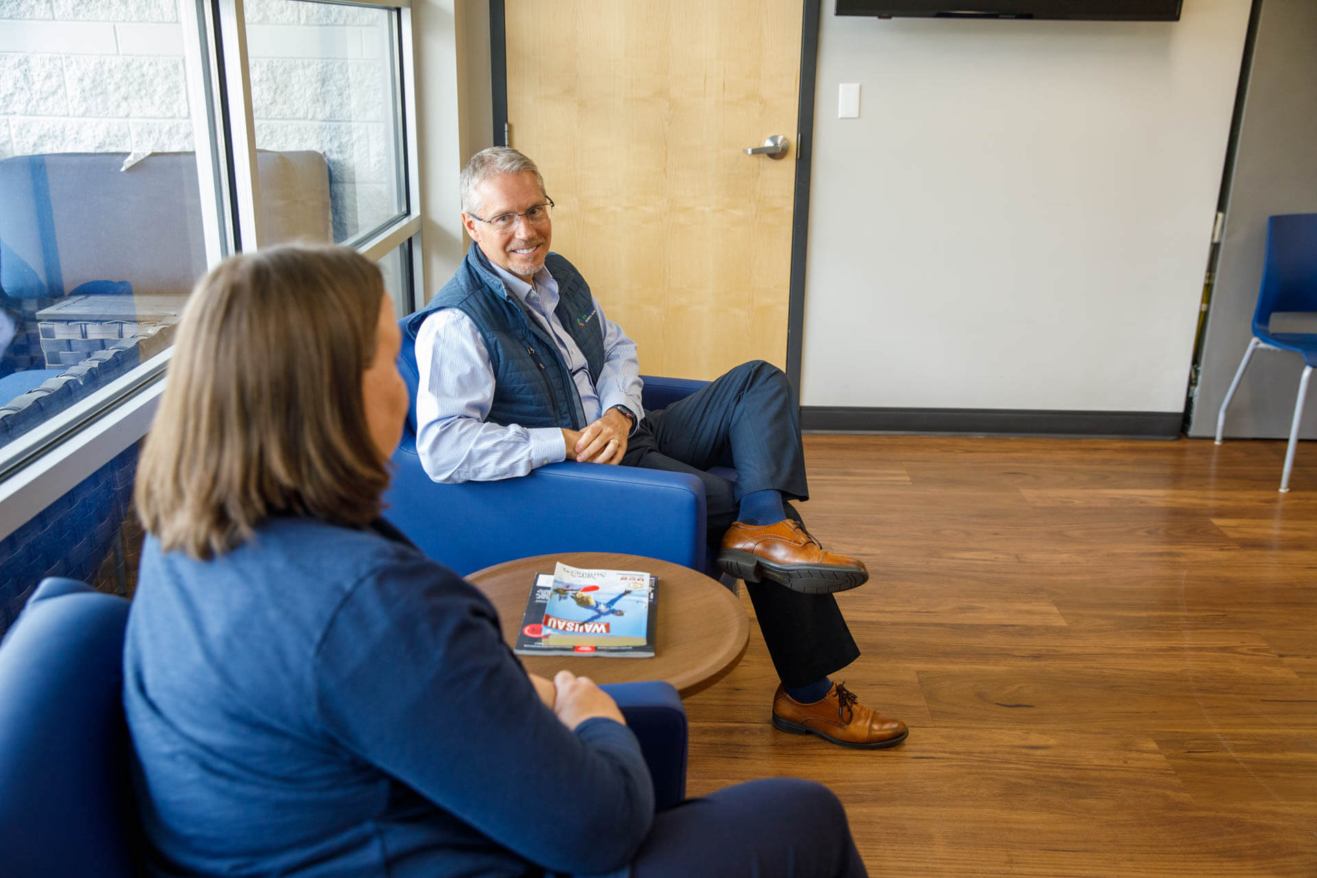 an image of an eo johnson account executive talking to a prospect about business technology