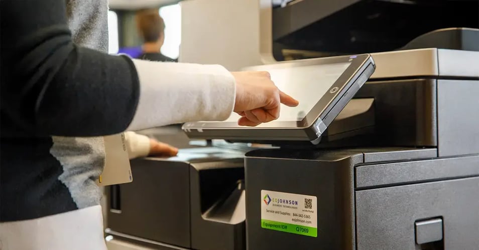 an image of an eo johnson multifunction printer being used in an office setting