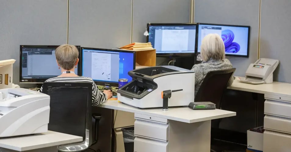 an image of documents being securely stored in document management software by eo johnson