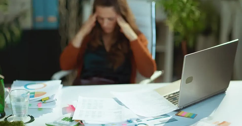 a frustrated employee due to information overload in the workplace