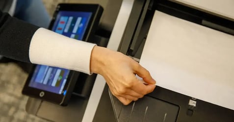 Using a modern office printer to demonstrate efficient cloud print infrastructure and serverless management.