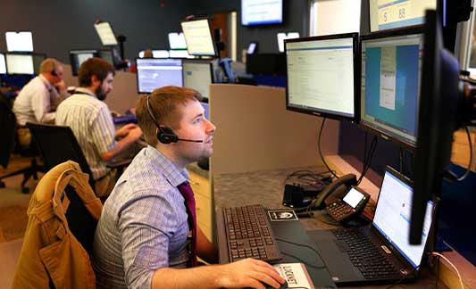 IT support center, employee speaking to customer