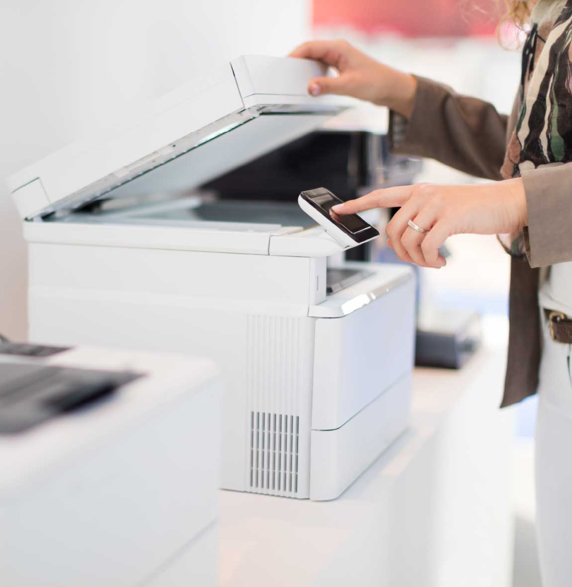 Employee using multifunction printer