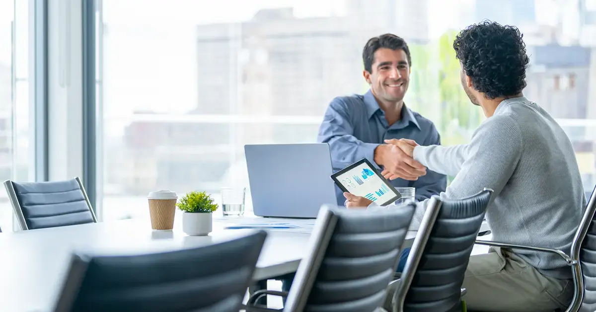 image of two professionals reviewing an RFP at a conference table