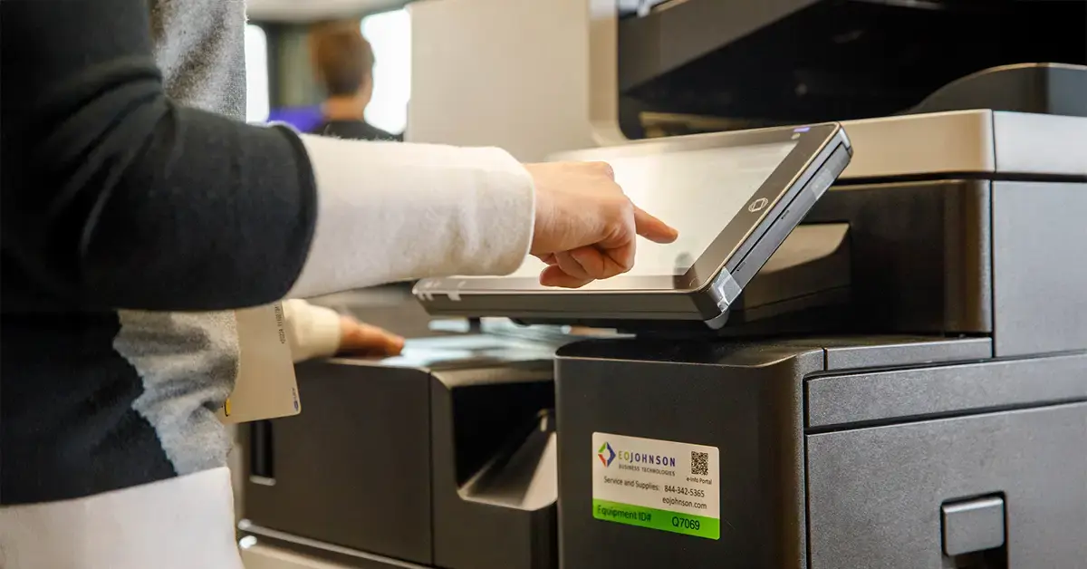 an image of an eo johnson multifunction printer being used in an office setting