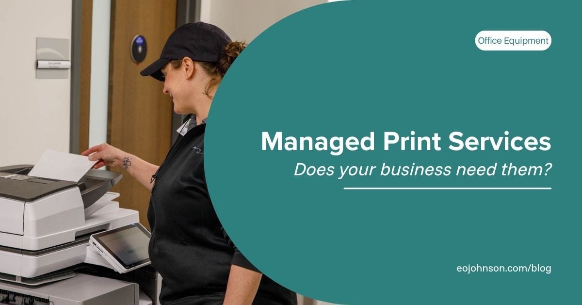 A woman in a black uniform uses a multifunction printer in an office hallway. Text overlay reads: Managed Print Services – Does your business need them?